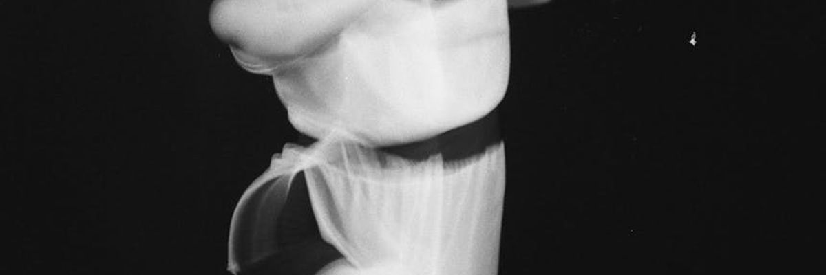 Blurred motion of a yoga flow movement